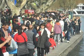 Crowds Gather Along The West Lake in Hangzhou