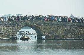 Crowds Gather Along The West Lake in Hangzhou