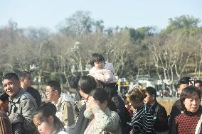 Crowds Gather Along The West Lake in Hangzhou