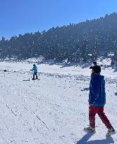 Tourists Enjoying  Ski Camp