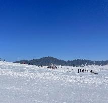 Tourists Enjoying  Ski Camp
