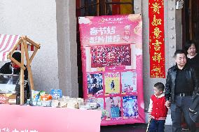 People Wait in Front of Movie Posters for the Lunar Year at A Cinema in Nanning