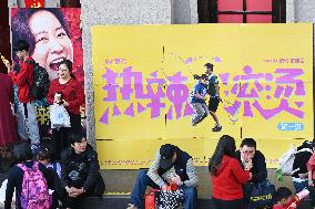 People Wait in Front of Movie Posters for the Lunar Year at A Cinema in Nanning