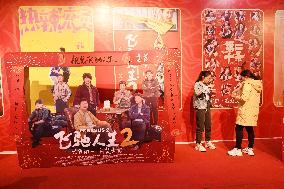 People Wait in Front of Movie Posters for the Lunar Year at A Cinema in Nanning