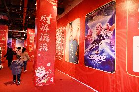 People Wait in Front of Movie Posters for the Lunar Year at A Cinema in Nanning