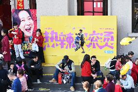 People Wait in Front of Movie Posters for the Lunar Year at A Cinema in Nanning