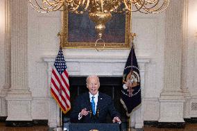 US President Joe Biden delivers remarks in the State Dining Room of the White House