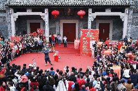 Tourists Watch A Folk Art Performance in Nanning