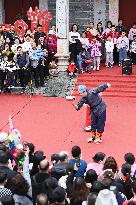 Tourists Watch A Folk Art Performance in Nanning