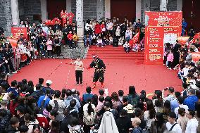 Tourists Watch A Folk Art Performance in Nanning