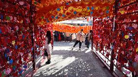 Tourists Visit A Blessing Wall in Xi'an