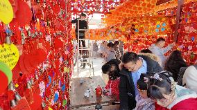 Tourists Visit A Blessing Wall in Xi'an