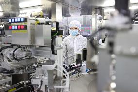Workers Make Contact Lenses