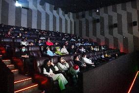 People Watch Movies at Fenghe Cinema in Renhuai