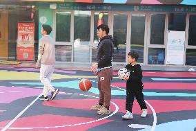 Young People Play Basketball at An Outdoor Street Basketball Court in Shanghai