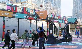 Young People Play Basketball at An Outdoor Street Basketball Court in Shanghai