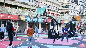 Young People Play Basketball at An Outdoor Street Basketball Court in Shanghai