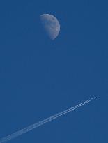Moon With A Passenger Plane, Linkoping, Sweden.