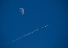 Moon With A Passenger Plane, Linkoping, Sweden.
