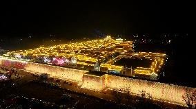 Tourists Visit The Brightly Lit Wanquan Right Guard City