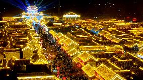 Tourists Visit The Brightly Lit Wanquan Right Guard City