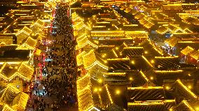 Tourists Visit The Brightly Lit Wanquan Right Guard City