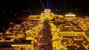 Tourists Visit The Brightly Lit Wanquan Right Guard City