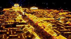 Tourists Visit The Brightly Lit Wanquan Right Guard City