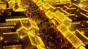 Tourists Visit The Brightly Lit Wanquan Right Guard City