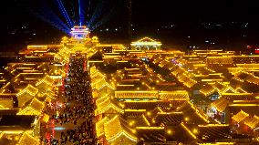 Tourists Visit The Brightly Lit Wanquan Right Guard City