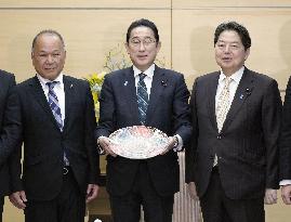 PM Kishida shows off dish of tiger puffer fish sashimi