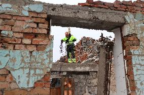 Utility workers repair consequences of Russian shelling in Kharkiv