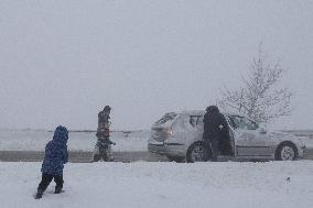 People During Snow Storm In Galicia