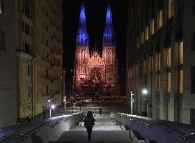 Catholic church illuminated with colorful lights in Kyiv