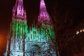 Catholic church illuminated with colorful lights in Kyiv