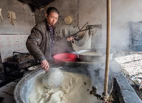 Craftsman make tofu in traditional ways in Hebei,China