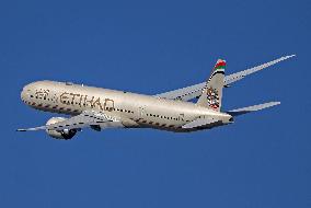 Boeing 777 with old Etihad livery taking off from Barcelona airport