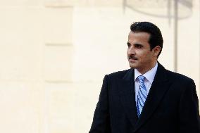 Qatar's Emir Sheikh Tamim Bin Hamad Al-Thani And French President Emmanuel