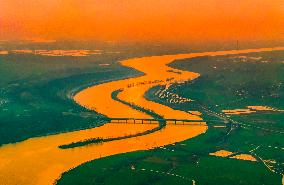 Winding River At Sunset in Suqian