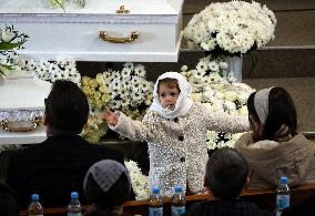 Memorial service for mother and 4mo baby killed in March 2 Russian drone attack on Odesa