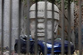 Colossal Olmec Head Replica Crushing A Tesla In Mexico City
