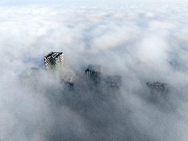 High-rise Buildings Loom in Advection Fog in Huai'an