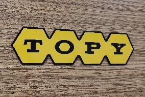 Topy Industries signage and logo