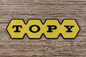 Topy Industries signage and logo