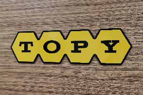 Topy Industries signage and logo