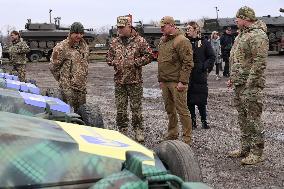 Volunteers hand over mobile baths and restored trophy vehicles to military in Odesa