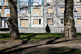 Windows boarded up with OSB sheets after shelling in Zaporizhzhia