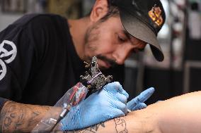 Tattoo Artist Mr Kaliman Working In A Tattoo