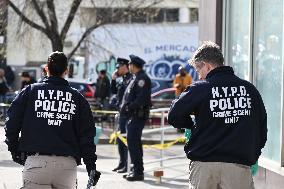 Crime Scene Investigators At Scene Of Two Year Old Boy Shot In Bronx New York