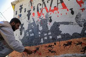 MIDEAST-GAZA-RAFAH-ARTIST-WALL PAINTING